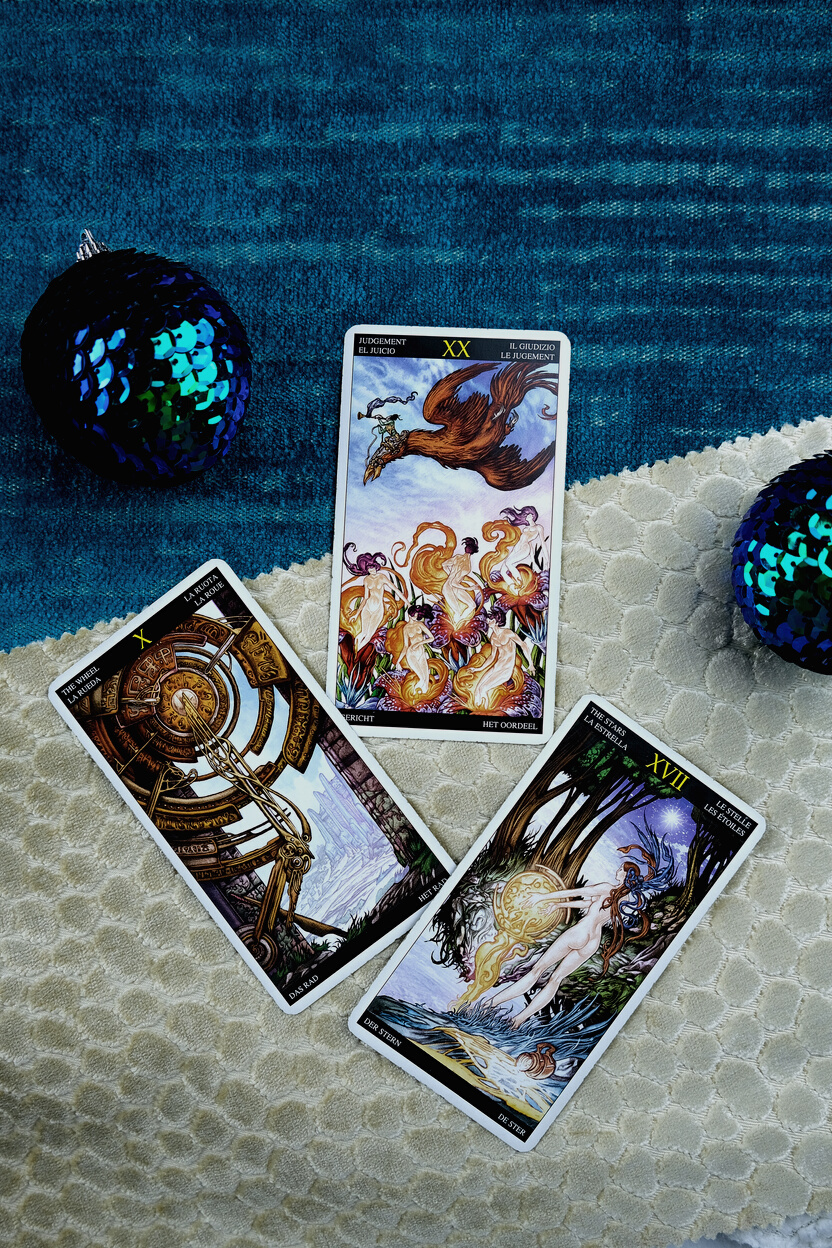 A Few Tarot Cards on a White and Blue Furry Textile